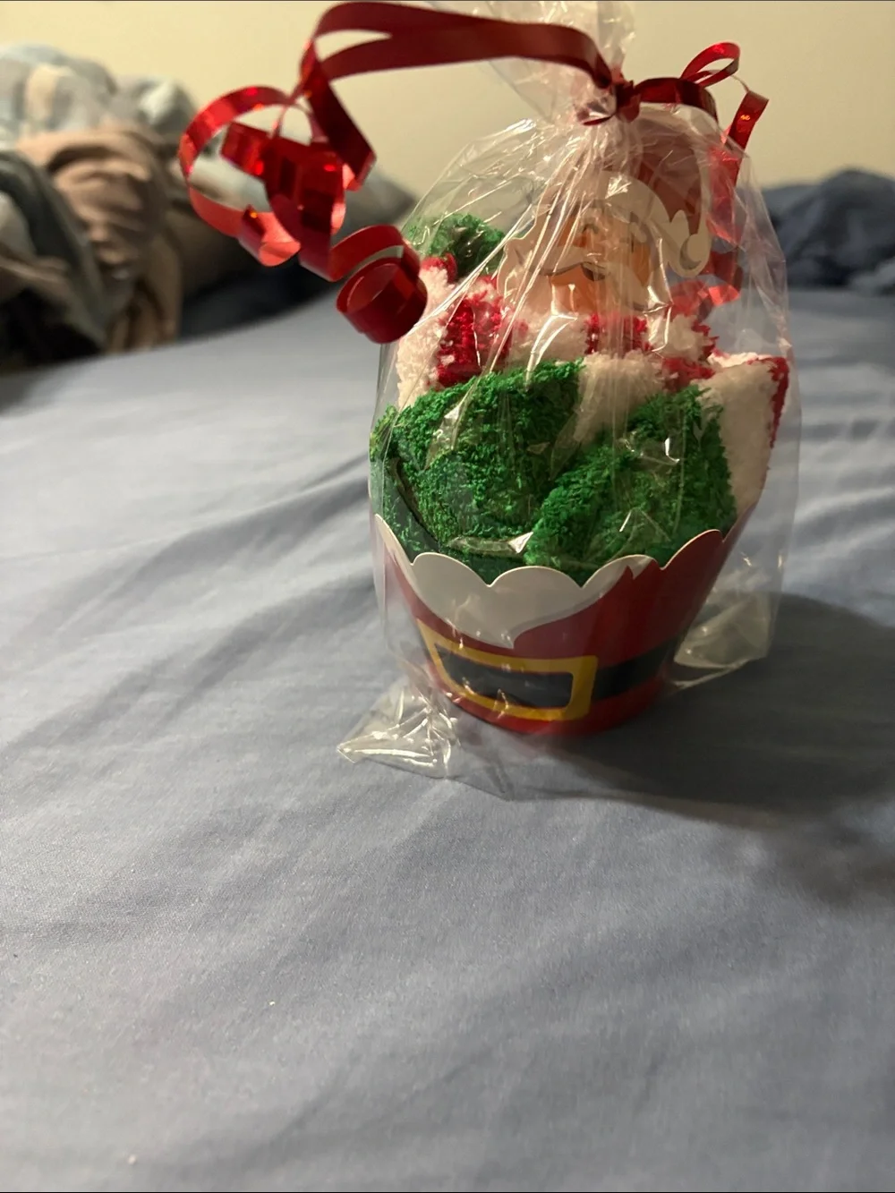 Holiday Santa Cupcake sock Gift - Red, Green, White wrapped and tied with ribbon